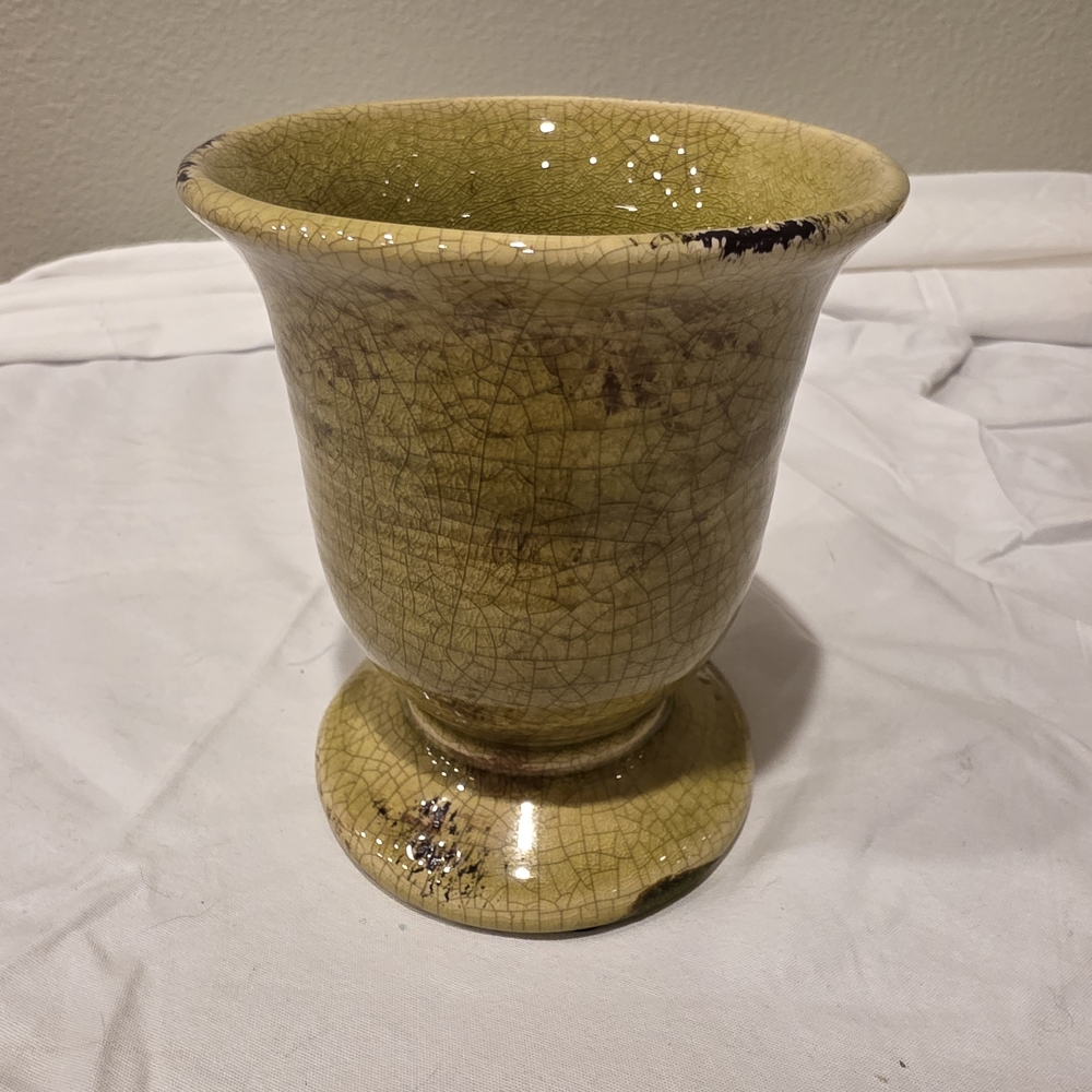 Chinese Yellow crackle glaze earthenware vase with a flared rim and footed base.